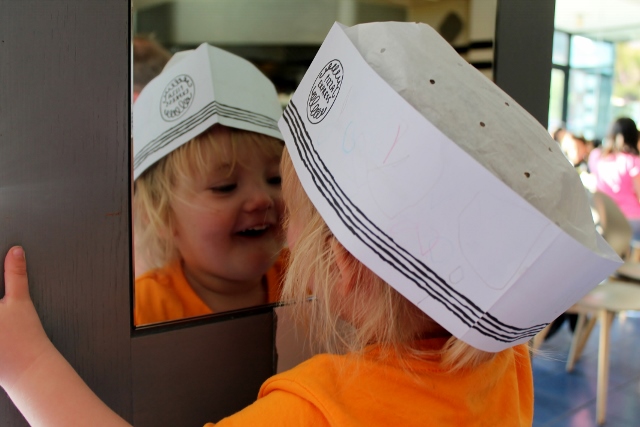 toddler looking in mirror