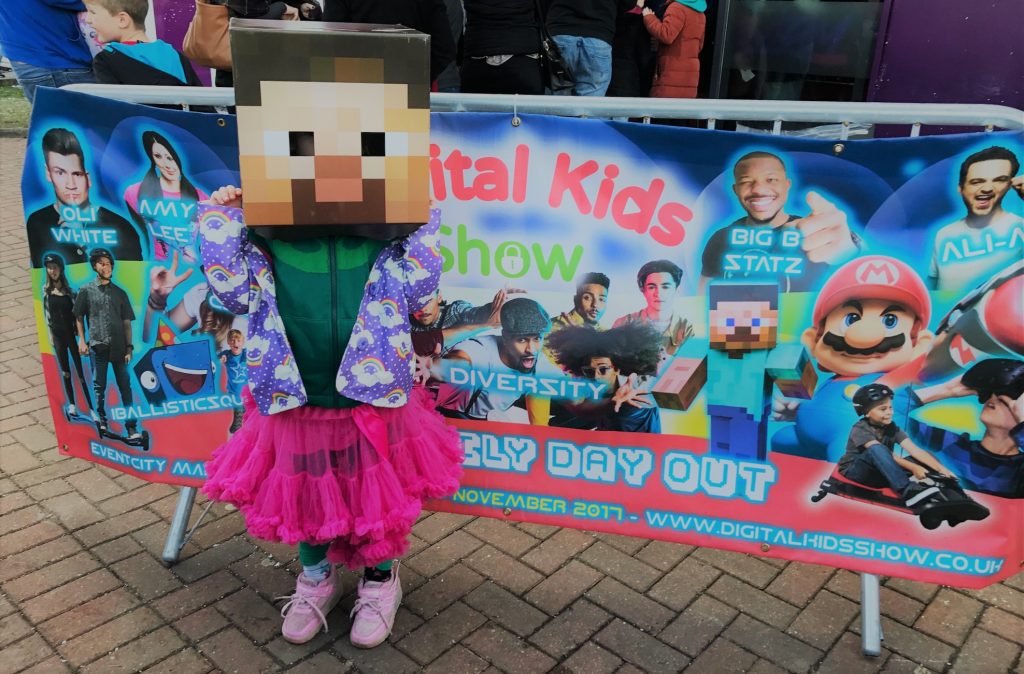 digital kids show sign with kid dressed as Steve Minecraft